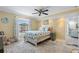 Comfortable bedroom with a large window and access to the pool area at 13035 91St Ave, Seminole, FL 33776
