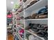 Organized walk-in closet with ample shelving for shoes and accessories at 13035 91St Ave, Seminole, FL 33776