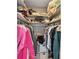Walk-in closet with ample storage featuring hanging racks, shelves, and organizing bins at 13035 91St Ave, Seminole, FL 33776