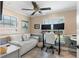 Functional home office with dual monitors, ample lighting, and comfortable seating at 13035 91St Ave, Seminole, FL 33776