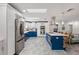 Spacious kitchen with stainless steel appliances, custom cabinets, and a large island with bar seating at 13035 91St Ave, Seminole, FL 33776