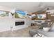 Comfortable living room with large TV over fireplace and stylish decor at 13035 91St Ave, Seminole, FL 33776
