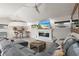 Cozy living room area with a fireplace, bar, and an inviting seating arrangement at 13035 91St Ave, Seminole, FL 33776