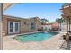 Inviting backyard pool area with paved deck, lounge seating and access from multiple points of the home at 13035 91St Ave, Seminole, FL 33776