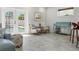 Relaxing sitting area with stylish chairs and a view of the pool through the glass doors at 13035 91St Ave, Seminole, FL 33776