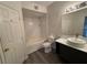 Bathroom with shower and tub combo, modern vanity and new floors at 13243 Sanctuary Cove Dr # 204, Temple Terrace, FL 33637