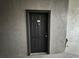 Condo unit 204 features a black front door and updated hardware at 13243 Sanctuary Cove Dr # 204, Temple Terrace, FL 33637