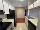 Compact kitchen features sleek stainless-steel appliances and plenty of counter space at 13243 Sanctuary Cove Dr # 204, Temple Terrace, FL 33637