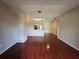 Spacious living room with sleek hardwood floors and modern recessed lighting at 13243 Sanctuary Cove Dr # 204, Temple Terrace, FL 33637
