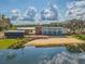 Modern waterfront home featuring sleek design, beach access, and beautiful views at 13614 Stevenson Ln, Odessa, FL 33556