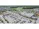 Aerial view of a Publix grocery store and strip mall in a vibrant, planned residential community at 13614 Stevenson Ln, Odessa, FL 33556