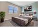 Cozy bedroom with a comfy bed, large window, and a TV, perfect for relaxation at 13614 Stevenson Ln, Odessa, FL 33556