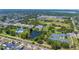 Aerial view of community amenities including a pool, tennis courts, ball fields, and a pond at 1400 63Rd S Ave, St Petersburg, FL 33705