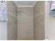 Bathroom shower with tile surround, modern shower head and decorative accent tile at 1400 63Rd S Ave, St Petersburg, FL 33705