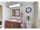 Bathroom featuring a granite vanity, undermount sink, modern lighting, and toilet at 1400 63Rd S Ave, St Petersburg, FL 33705