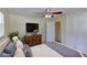 Staged bedroom featuring hard surface floors, ceiling fan, closet and furniture at 1400 63Rd S Ave, St Petersburg, FL 33705