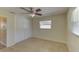 Cozy bedroom featuring tile floors, ceiling fan, closet and natural light at 1400 63Rd S Ave, St Petersburg, FL 33705