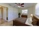 Staged bedroom with ceiling fan, double closets, tiled floors and lots of natural light at 1400 63Rd S Ave, St Petersburg, FL 33705