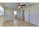 Bright bedroom with ceiling fan, double closets, tiled floors and access to en-suite bathroom at 1400 63Rd S Ave, St Petersburg, FL 33705