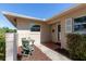 Charming front entrance with red brick tiling and a small area for seating at 1400 63Rd S Ave, St Petersburg, FL 33705