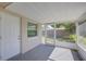 Screened patio with concrete flooring and views of the fenced backyard at 1400 63Rd S Ave, St Petersburg, FL 33705