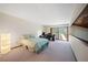 Spacious bedroom features a carpeted floor, a modern desk, and a large window for natural light at 14825 Lake Magdalene Cir, Tampa, FL 33613