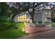 Stunning exterior view featuring brick pathway, modern architecture, and lush landscaping at 14825 Lake Magdalene Cir, Tampa, FL 33613