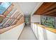 Hallway with wood accents and a unique glass ceiling providing natural light at 14825 Lake Magdalene Cir, Tampa, FL 33613