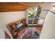 The living room boasts brick flooring, custom shelving, and lots of natural light from large window at 14825 Lake Magdalene Cir, Tampa, FL 33613