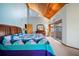 Charming main bedroom with lots of natural light, wood ceiling, and neutral carpeting at 14825 Lake Magdalene Cir, Tampa, FL 33613
