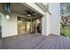 Covered patio with ceiling fan and access to interior rooms via sliding glass doors at 14825 Lake Magdalene Cir, Tampa, FL 33613