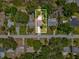 Aerial shot of property showcasing the roofline, backyard, and surrounding neighborhood at 173 21St Se Ter, Largo, FL 33771
