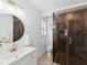 Stylish bathroom featuring a frameless glass shower, modern vanity, and elegant fixtures at 173 21St Se Ter, Largo, FL 33771