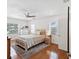 Bright bedroom with hardwood floors, neutral walls, and a comfortable bed with a woven headboard at 173 21St Se Ter, Largo, FL 33771