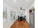 Bright dining area with a ceiling fan and access to the exterior through glass doors at 173 21St Se Ter, Largo, FL 33771