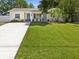 Charming single-story home featuring a well-manicured lawn and inviting curb appeal at 173 21St Se Ter, Largo, FL 33771