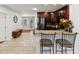 Open kitchen with stainless steel appliances, granite countertops, and an eat-in bar area at 173 21St Se Ter, Largo, FL 33771