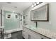Modern bathroom with granite countertops, frameless shower, and stylish fixtures at 2033 Arbor Dr, Clearwater, FL 33760