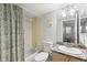Full bathroom featuring a vanity, toilet, tub, and a shower with a decorative curtain at 2033 Arbor Dr, Clearwater, FL 33760