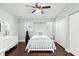 Cozy bedroom featuring hardwood floors, natural light, and a closet for convenient storage at 2033 Arbor Dr, Clearwater, FL 33760