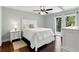 Bright bedroom featuring a balcony and plenty of natural light at 2033 Arbor Dr, Clearwater, FL 33760