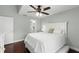 Bright bedroom featuring a ceiling fan and en-suite bathroom at 2033 Arbor Dr, Clearwater, FL 33760