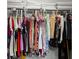 Organized walk-in closet with shelves, hanging rods, and ample storage for clothing and accessories at 2033 Arbor Dr, Clearwater, FL 33760