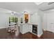 Open concept dining area, wet bar and view of the fireplace in a modern home at 2033 Arbor Dr, Clearwater, FL 33760