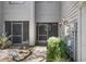 This well-kept entryway features plants, an updated door, and a fire extinguisher, adding to the home's charm at 2033 Arbor Dr, Clearwater, FL 33760