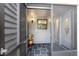 Inviting entryway with tiled floor, screened door, and stylish front door at 2033 Arbor Dr, Clearwater, FL 33760