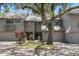 Charming two-story townhome with a well-maintained lawn and mature tree in a desirable neighborhood at 2033 Arbor Dr, Clearwater, FL 33760