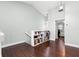 Spacious hallway with hardwood floors and book shelves at 2033 Arbor Dr, Clearwater, FL 33760