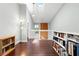 Hallway with hardwood floors and book shelves at 2033 Arbor Dr, Clearwater, FL 33760