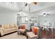 Inviting living room with hardwood floors and an open layout into a modern kitchen and dining area at 2033 Arbor Dr, Clearwater, FL 33760